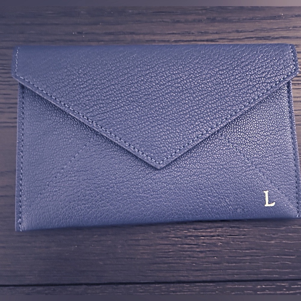 Real leather blue “ envelope” with sueded liner and gold foil monogrammed “L